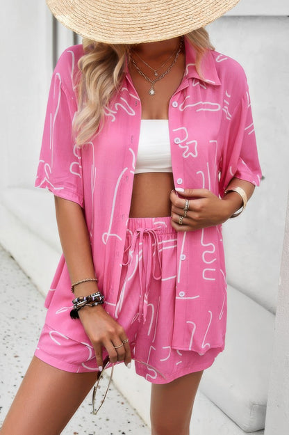 Model wearing CCWHOLESALECLOTHING pink two piece shorts set with open button shirt and drawstring waist shorts