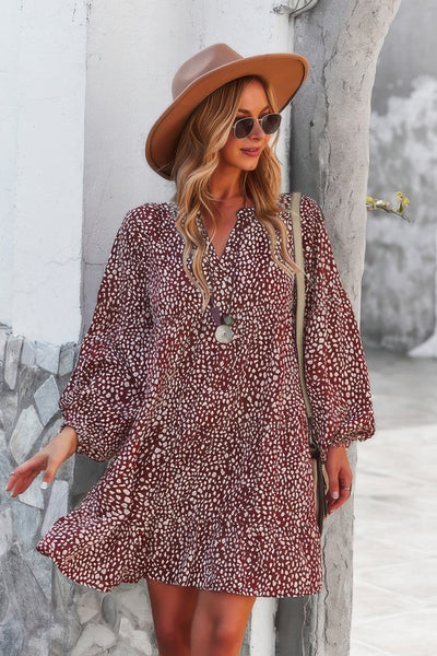 CCWHOLESALECLOTHING model wearing a brown v neck polka dot tunic dress with long puff sleeves and hat