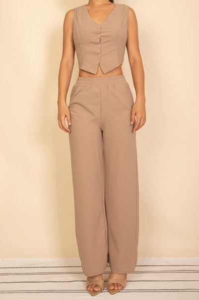 Stylish model wearing a Tailored Button Vest paired with matching wide-leg pants for a chic look