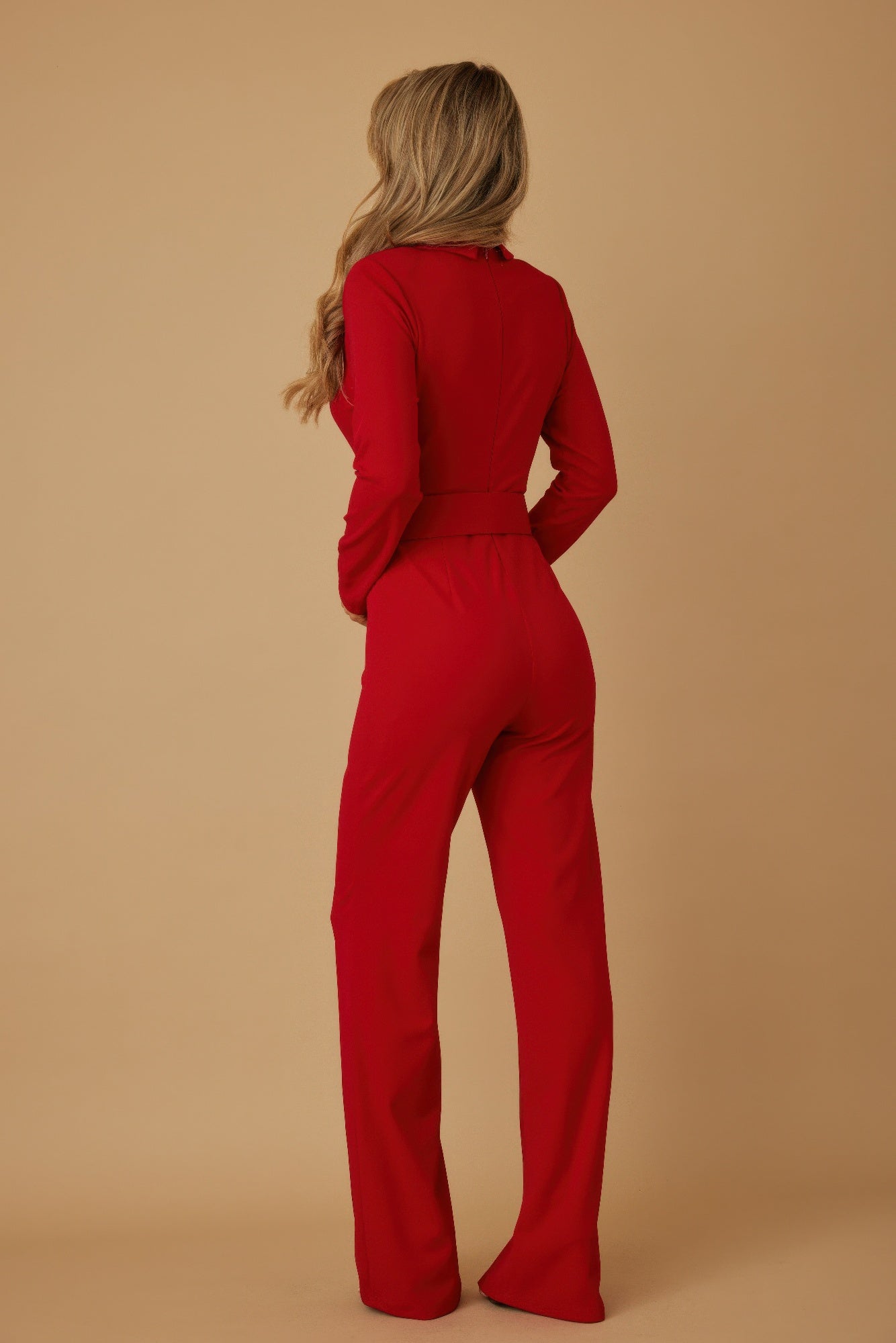 Back view of a red VALENTINE Tailored Power Suit jumpsuit with long sleeves and stylish fit
