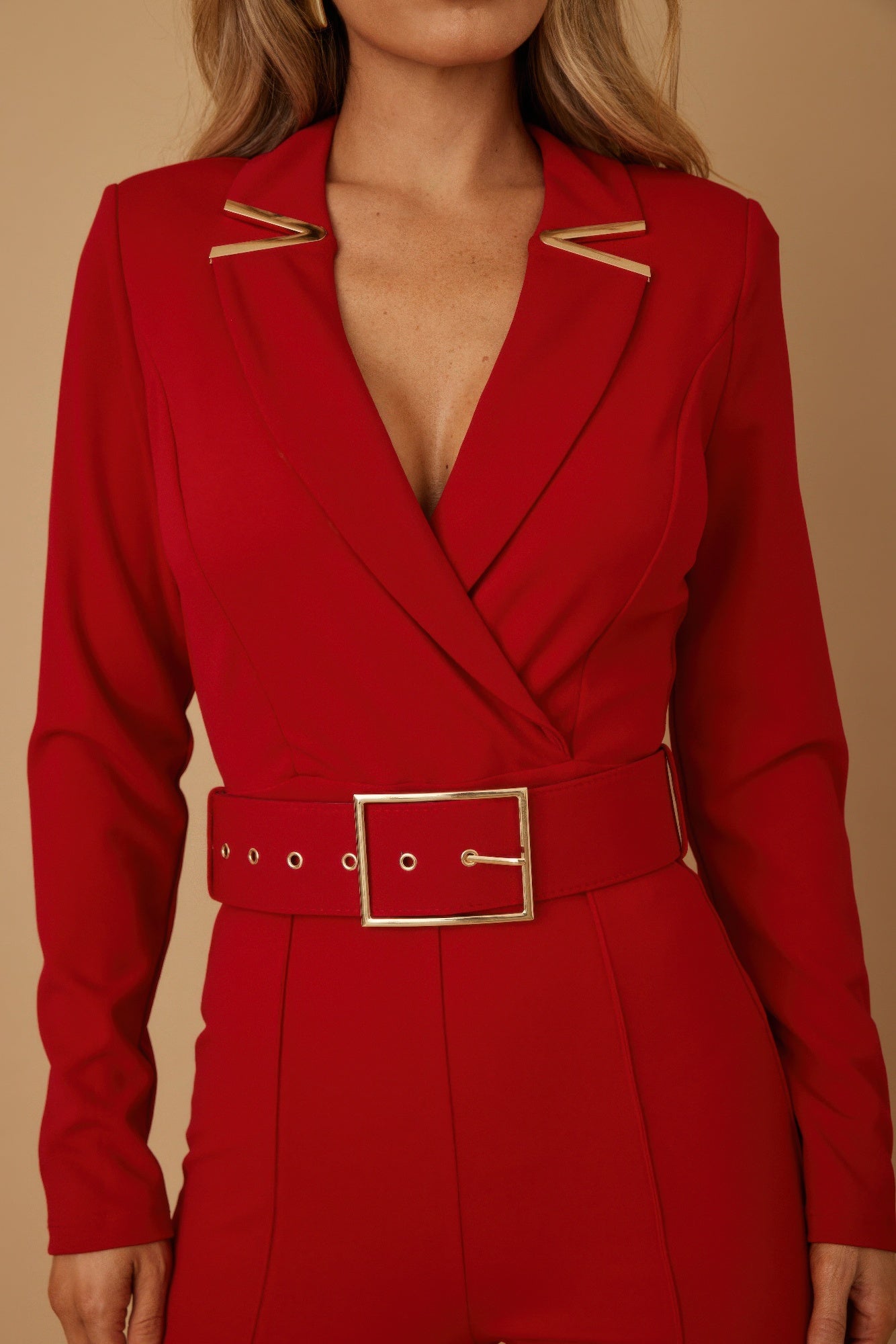 Valentine Tailored Power Suit in vibrant red with a stylish belt and elegant gold accents