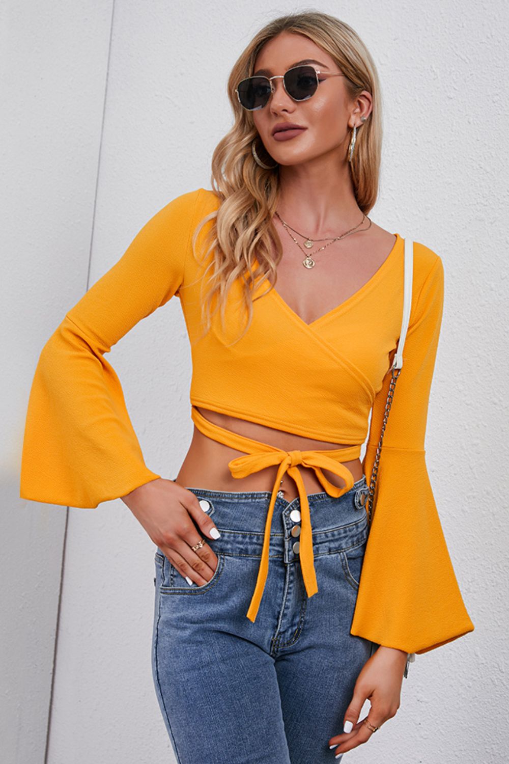 Trendsi Tie Front Cropped Top in Yellow with Long Bell Sleeves and Stylish Versatile Design