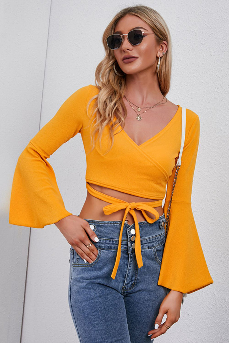 Trendsi Tie Front Cropped Top in Yellow with Long Bell Sleeves and Stylish Versatile Design