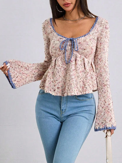 Trendsi Tie Front Flare Sleeve sweater with blue trim and textured knit paired with blue jeans