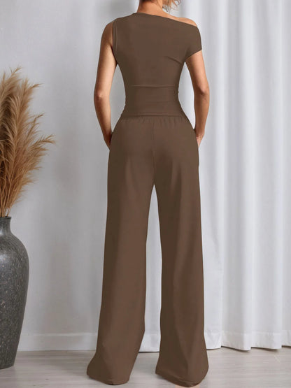 Brown apparel featuring a fitted top with trendy pants for a stylish look