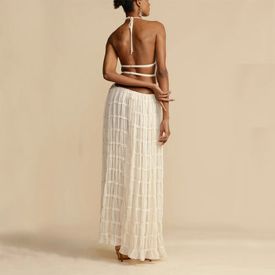 Elegant woman wearing a Trendy Halter Top & Maxi Skirt in a soft fabric with a stylish design