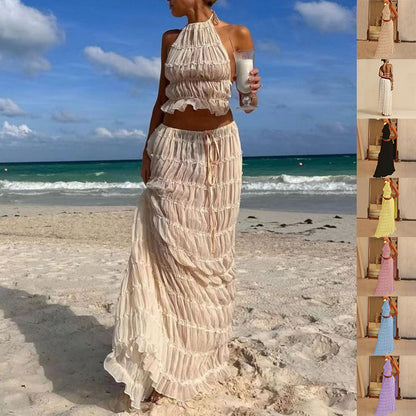 Model wearing a Trendy Halter Top & Maxi Skirt on the beach with ocean backdrop