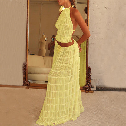Trendy Halter Top & Maxi Skirt in yellow featuring a stylish design and flowy fabric for a fashionable look