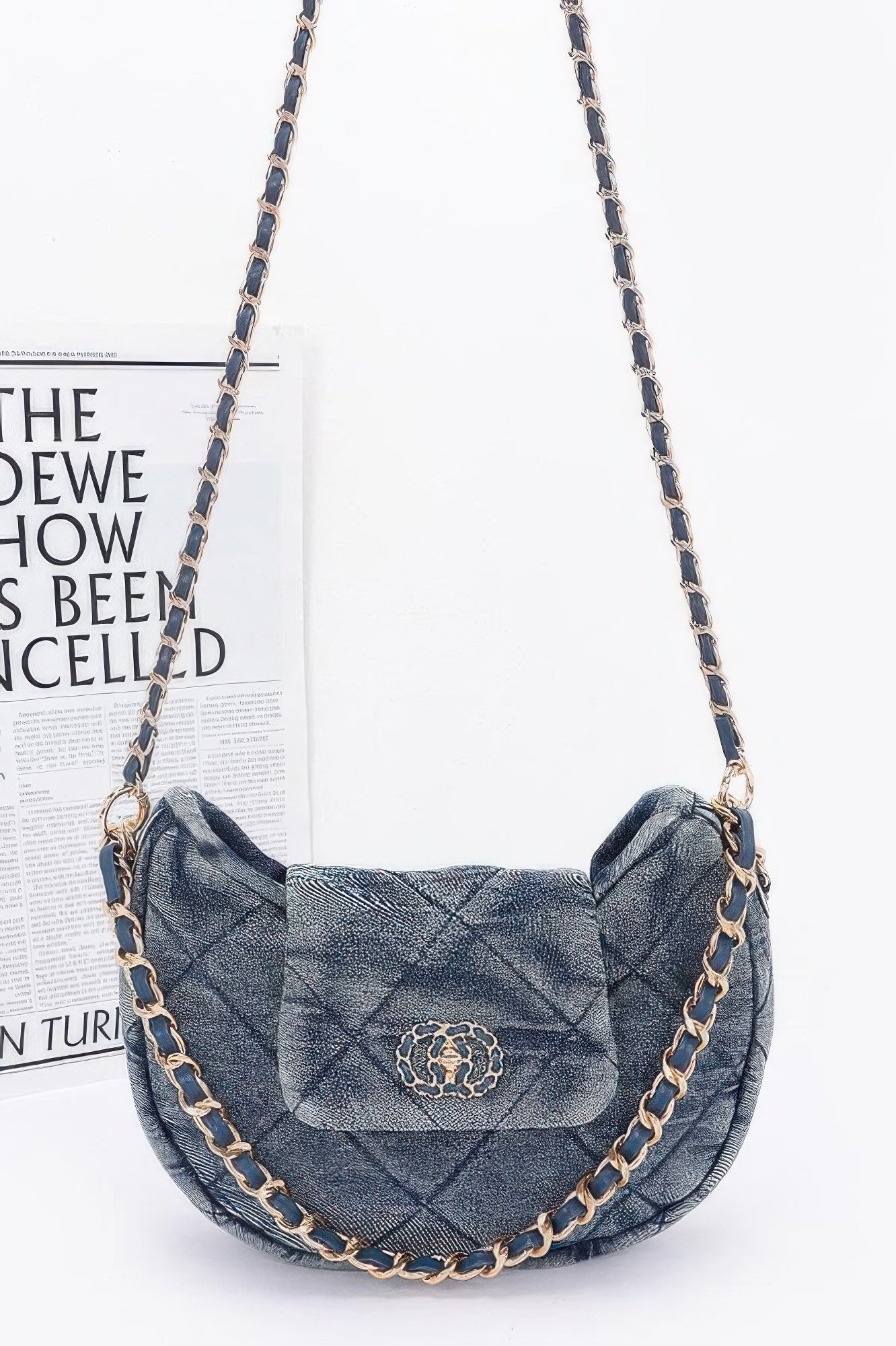 Denim Crossbody Bag quilted crescent flap with gold chain strap and decorative medallion ideal for casual outfits