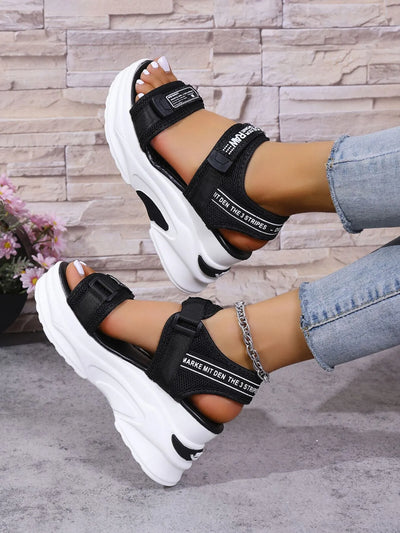 Platform Sport Sandals black Velcro chunky white sole on model wearing ankle chain and rolled jeans