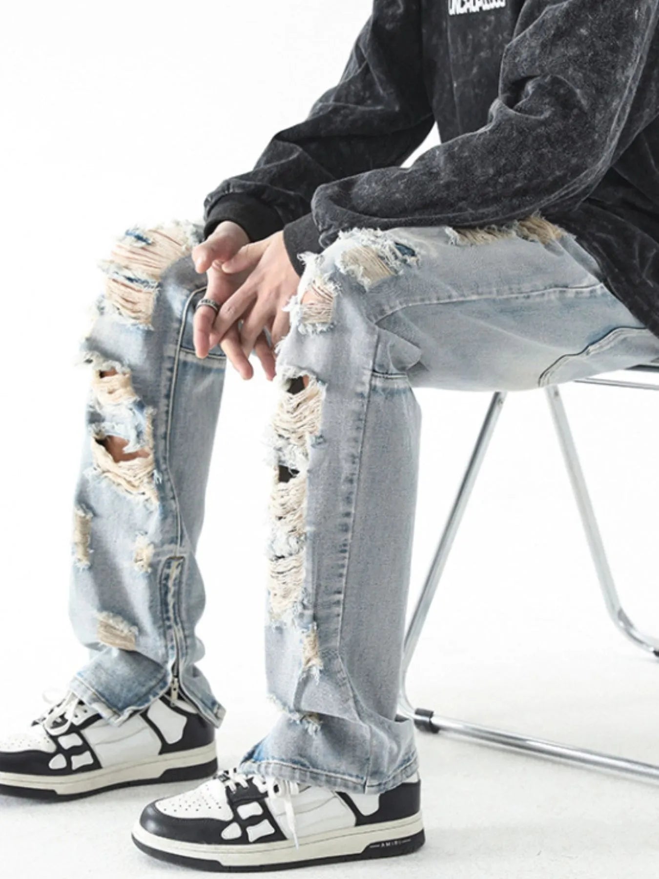 Trendsi men's distressed straight jeans light wash heavily ripped knees and thighs paired with black white sneakers