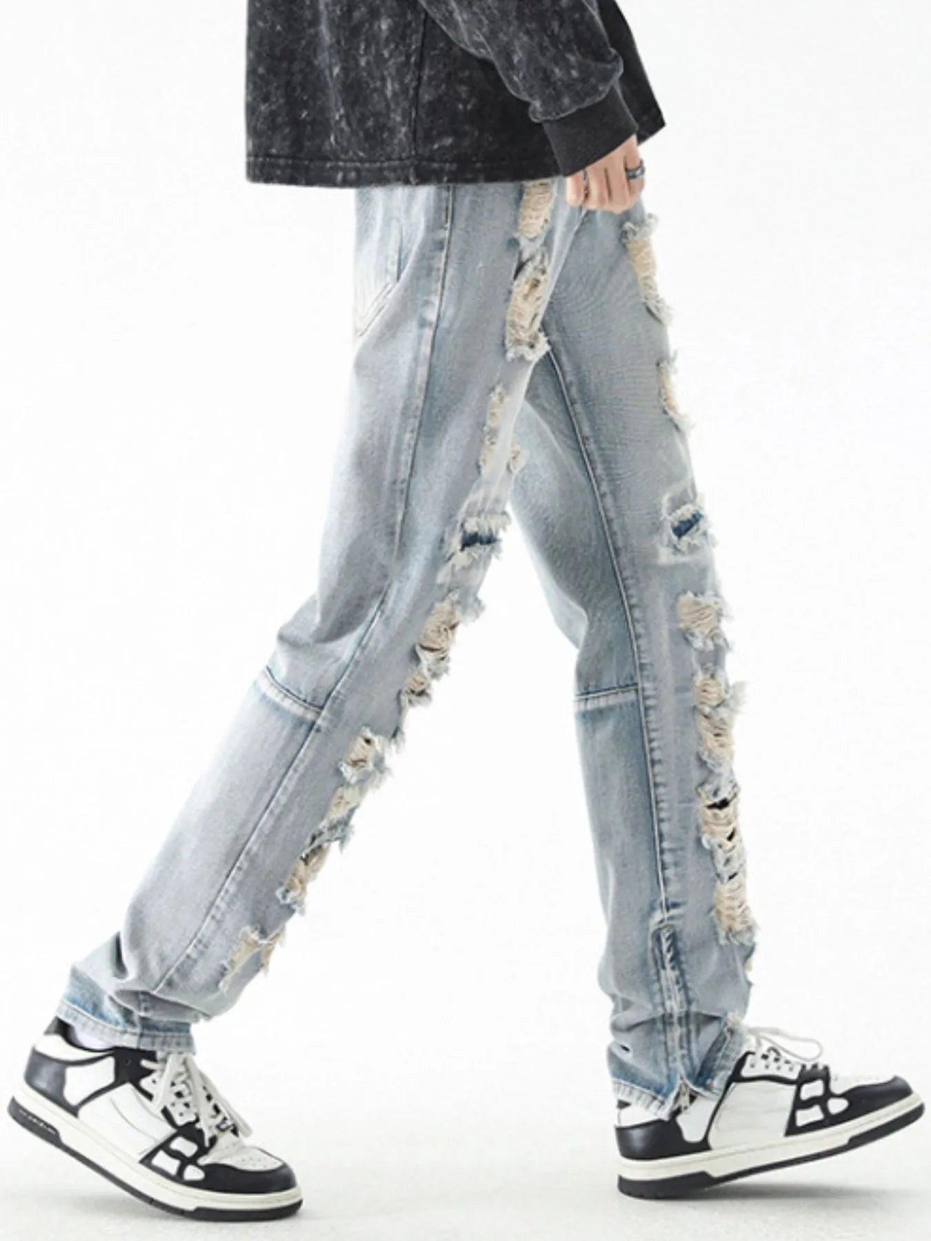 Trendsi men's distressed straight jeans light wash side ripped detail modeled with black sneakers