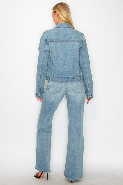 Artemis Vintage back view of model wearing light wash denim jacket and women's mid rise flare jeans