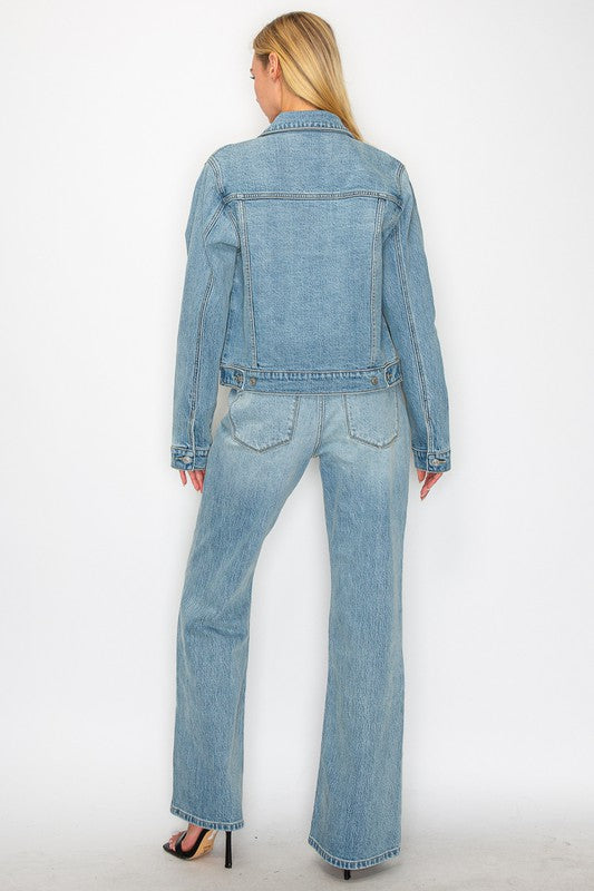 Artemis Vintage back view of model wearing light wash denim jacket and women's mid rise flare jeans
