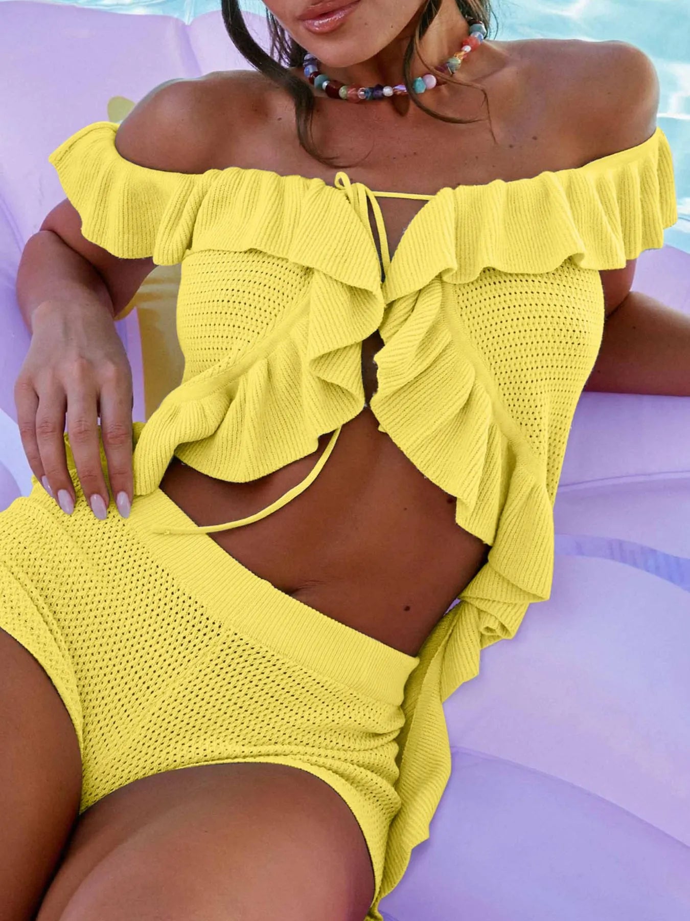 Yellow off-shoulder ruffle top with textured fabric and tie front detail by Trendsi