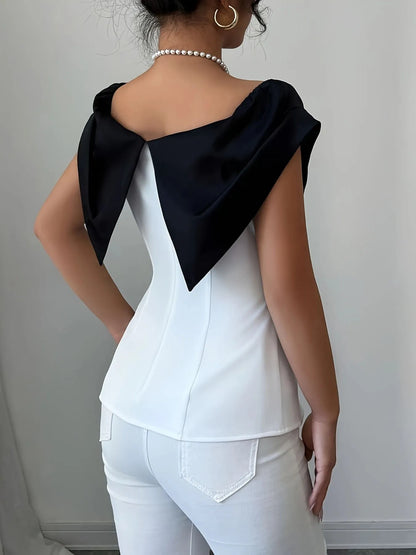 Trendsi apparel featuring a white top with a black Slit Contrast Color Cap design on the back