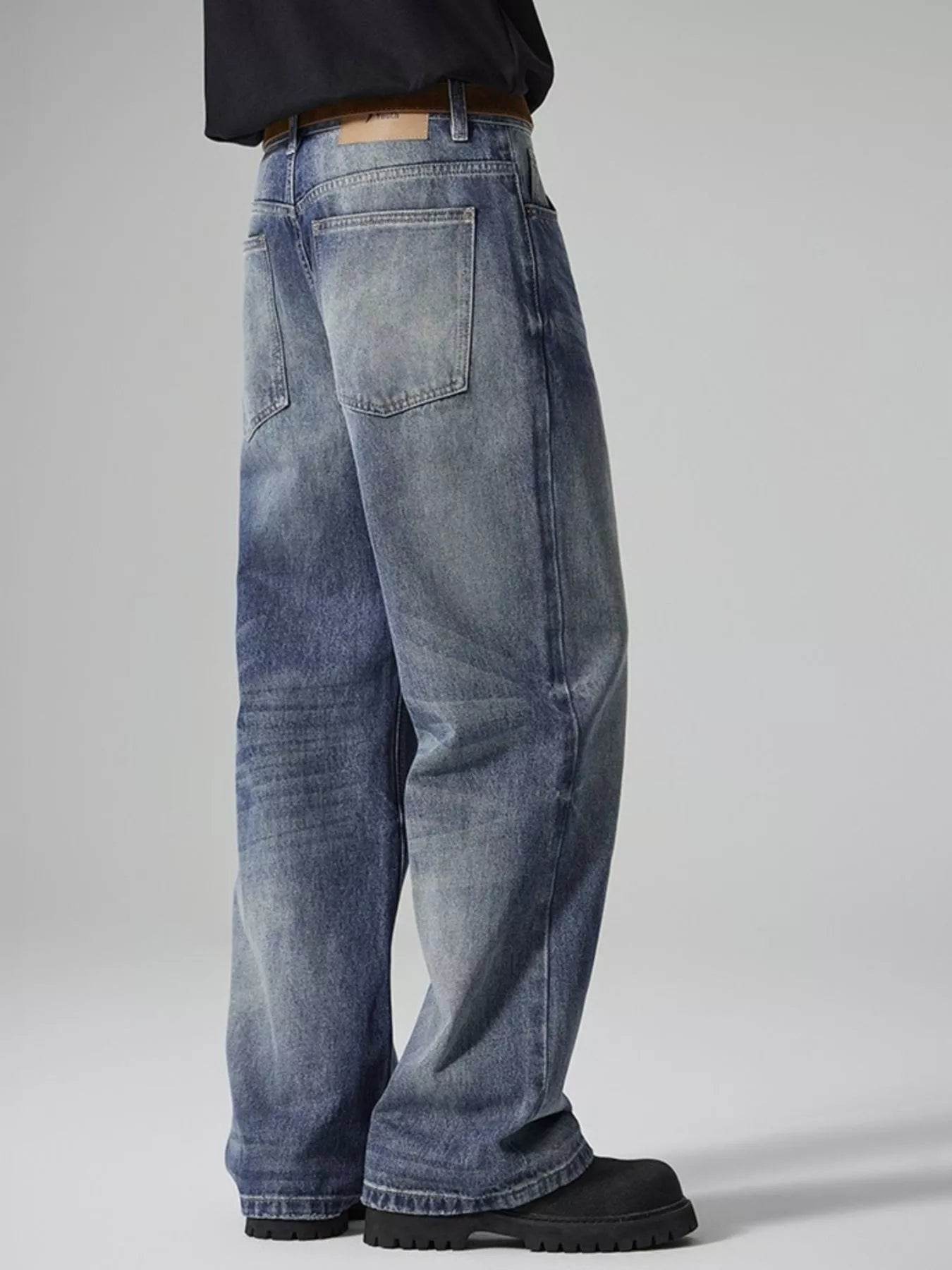 Side view of Wide Leg Washed Jeans featuring a relaxed fit and classic denim style