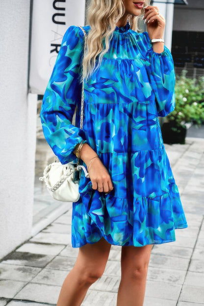 CCWHOLESALECLOTHING abstract print tiered dress in blue green with long puff sleeves and ruffle neck