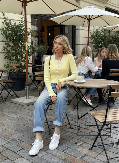 Yellow ribbed knit cardigan lifestyle image - cafe patio
