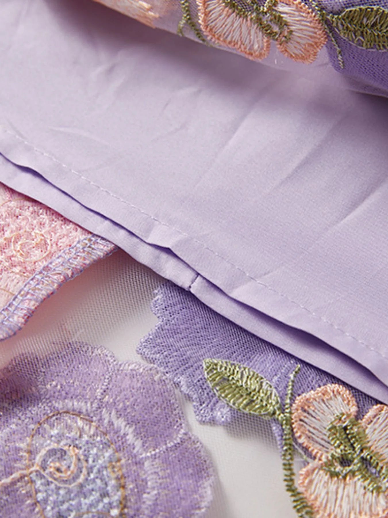 Trendsi Lined Evening Gown close up of lilac lining and floral embroidered tulle fabric detail