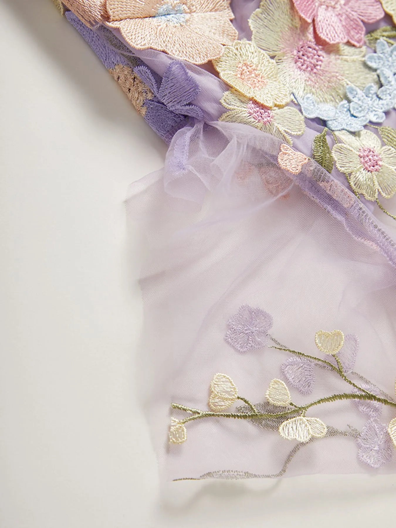 Trendsi Lined Evening Gown close up of pastel embroidered floral tulle with lavender sheer lining